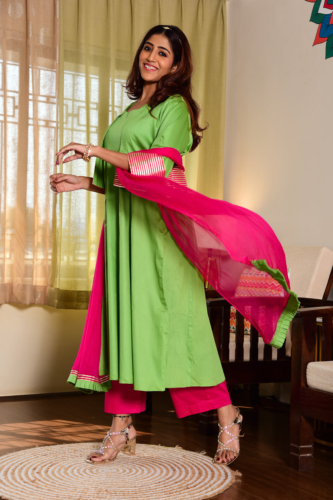 Green coloured 4 pc Flared outfit with Short Jacket and a contrast pant and a dupatta